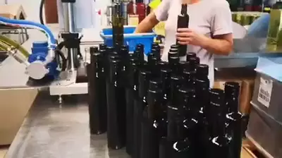 Olive oil bottling with hand